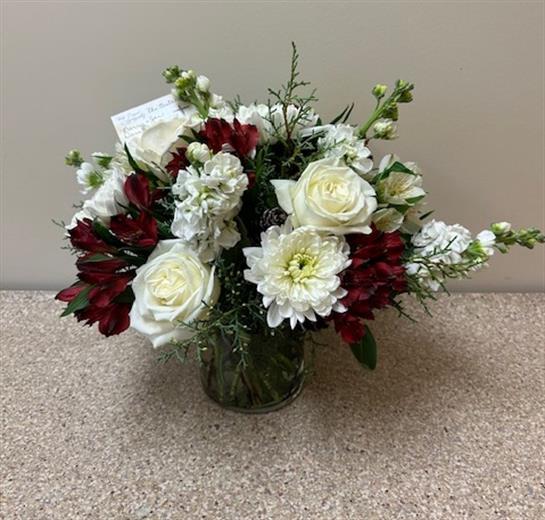 A bouquet of flowers in a glass vase