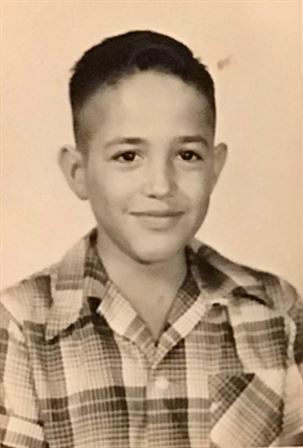 A boy in a plaid shirt