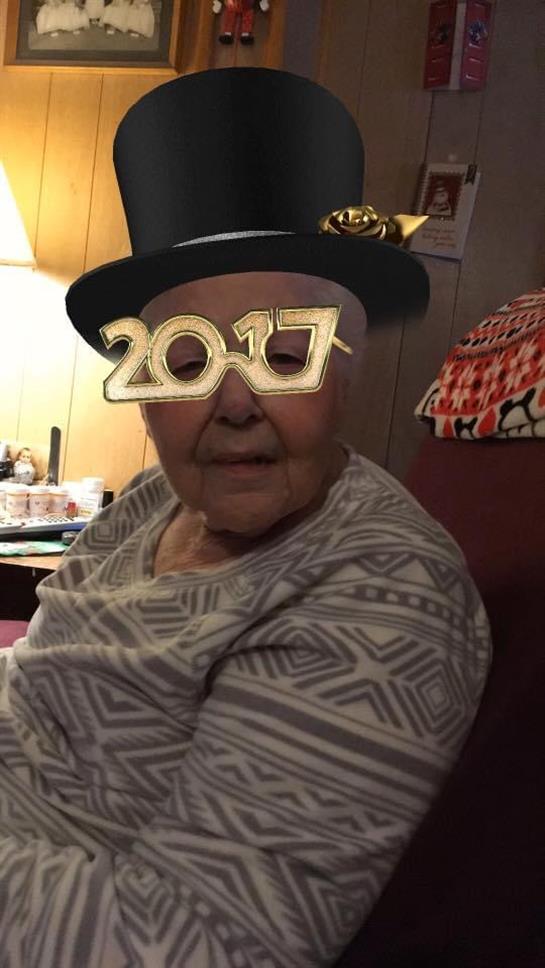 A woman wearing a hat and glasses