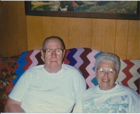 A man and woman sitting on a couch