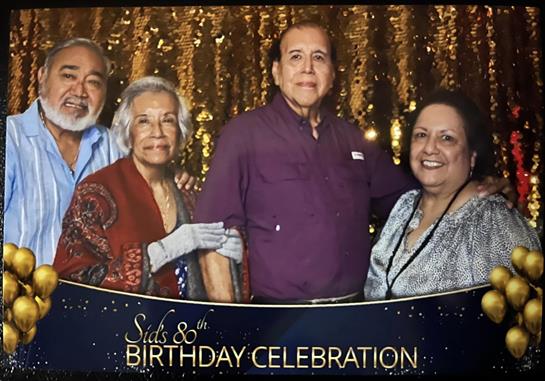 A group gathers for a meaningful birthday celebration, sharing smiles and memories.