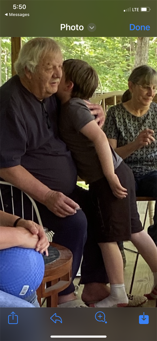 A man and child sitting on a chair