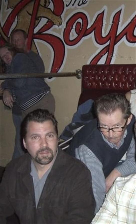 Friends gather in a lively local bar, sharing laughter and good moments in a vibrant setting.