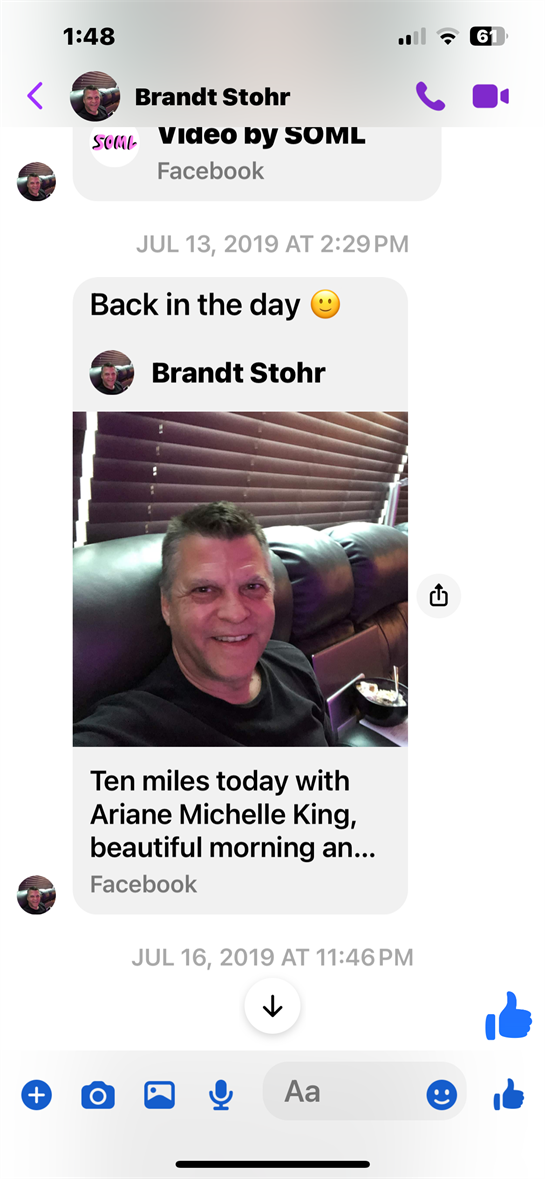 A man sits comfortably on a couch, enjoying a leisurely morning while reminiscing.