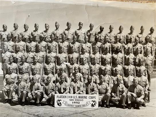 A group of men in uniform posing for a photo