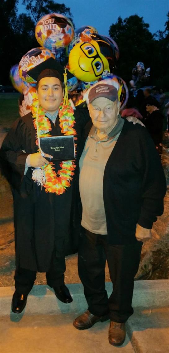 A man and a man posing for a picture