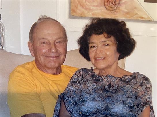 A man and woman sitting on a couch