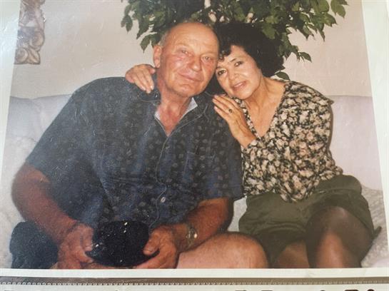A man and woman sitting on a couch