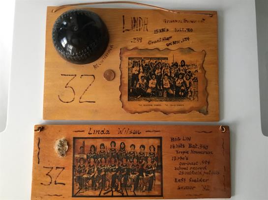 A plaque with a helmet and a coin