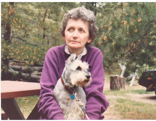A woman holding a dog