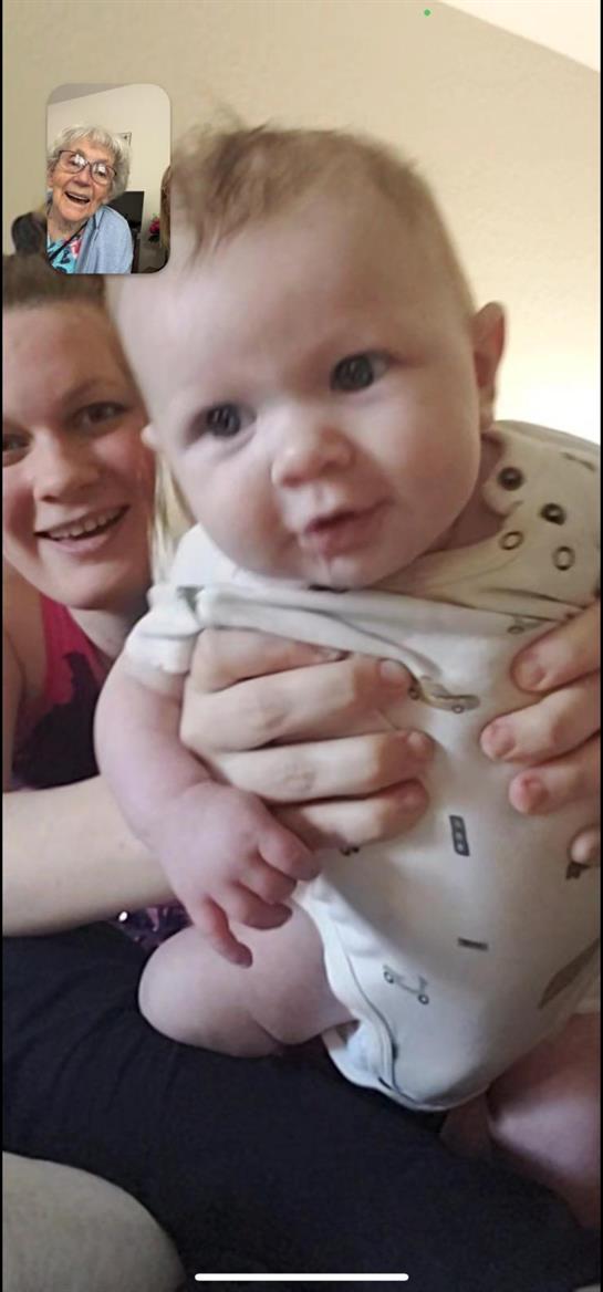 A woman holding a baby
