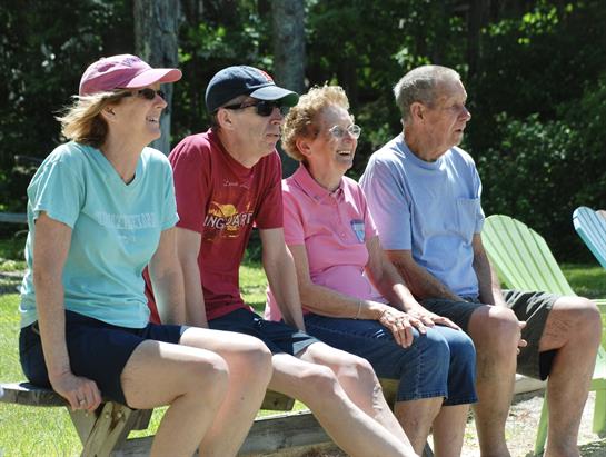 A group of people sitting on benches