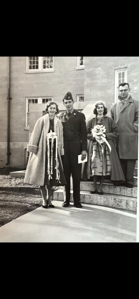 A group of people standing outside a building