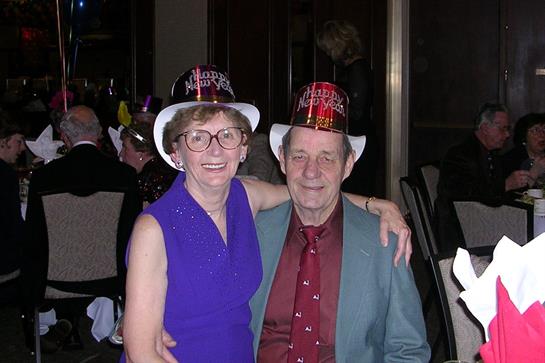 A man and woman wearing hats