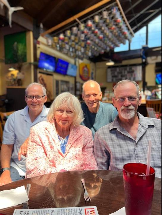 A group of people sitting at a table