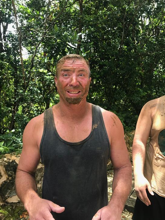 A man with mud on his face