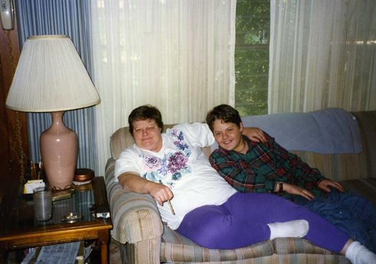 Two people sitting on a couch
