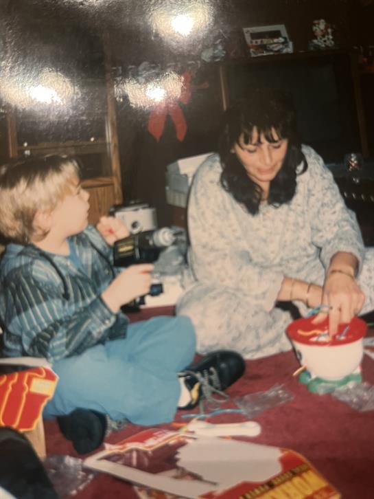 A woman and a child sitting on the floor