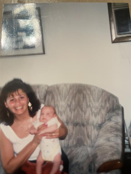 A woman holding a baby