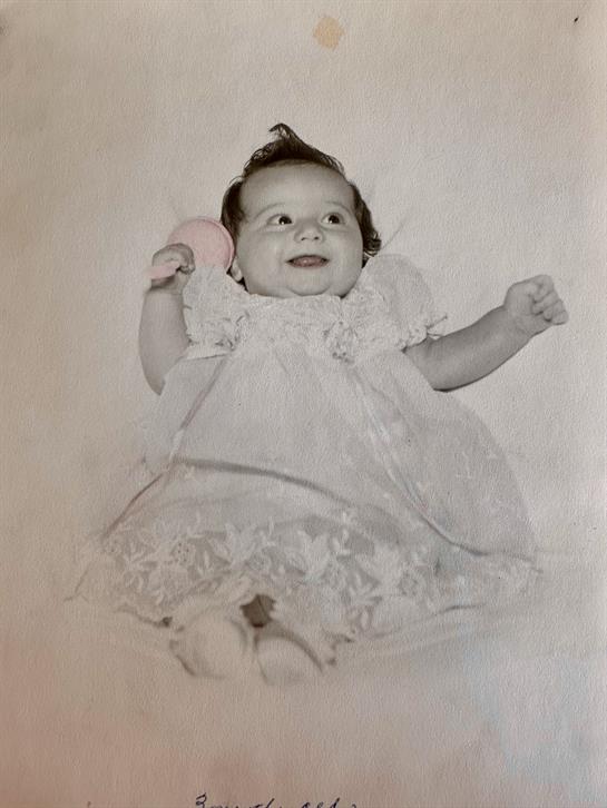 A baby in a dress