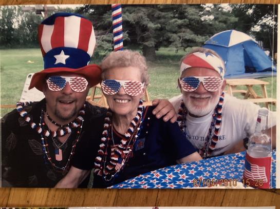 A group of people wearing sunglasses and a hat