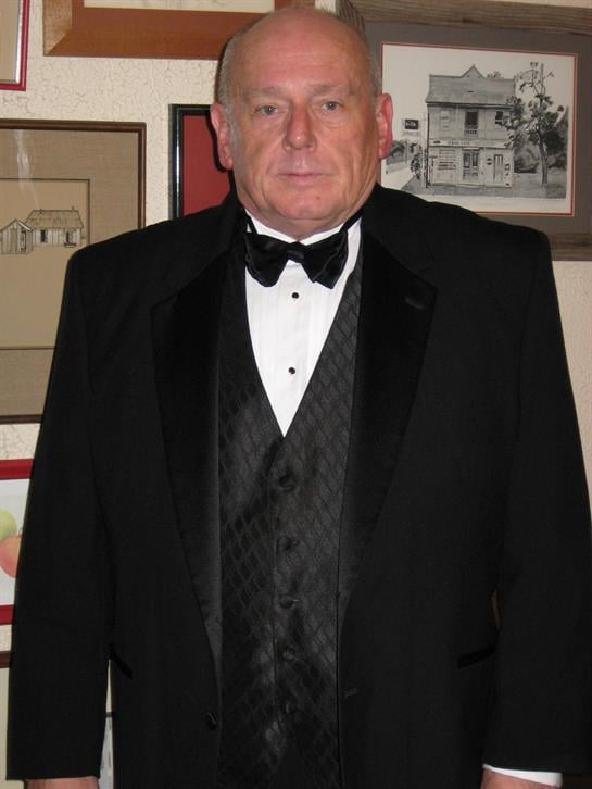 A man in a tuxedo and bow tie