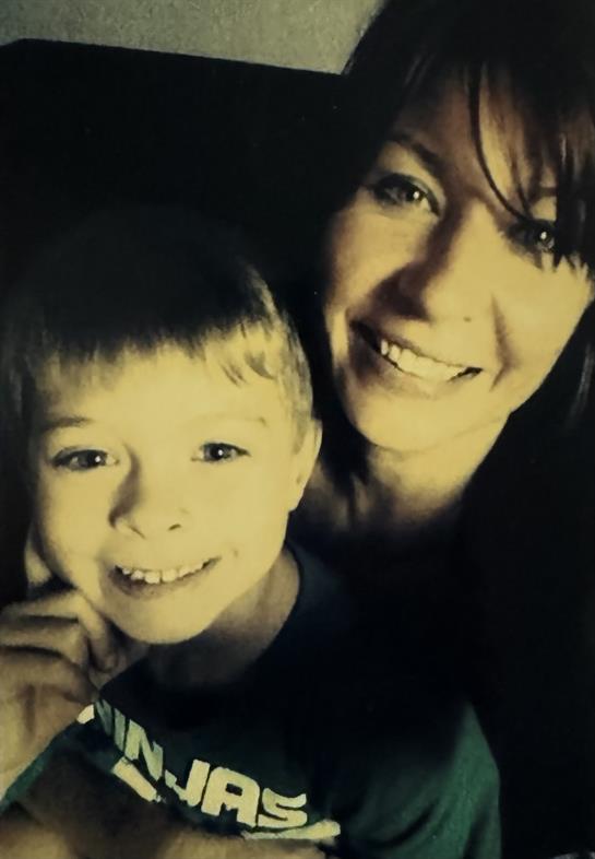 A woman and a boy taking a selfie