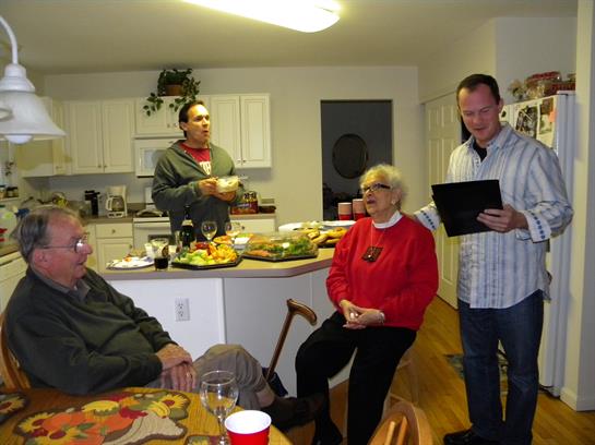 A group of people in a kitchen
