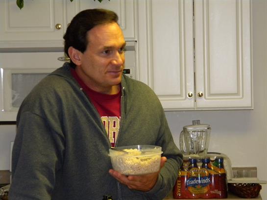 A man holding a bowl of food