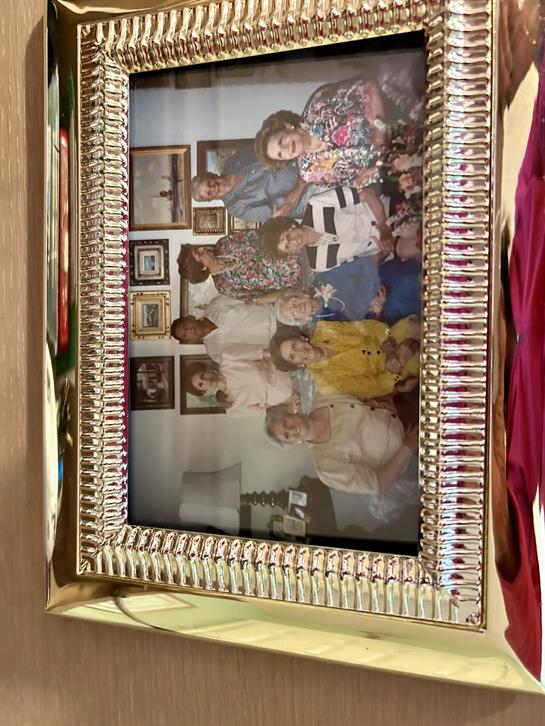 A vibrant gathering of family members sharing laughter and love in a cozy setting.