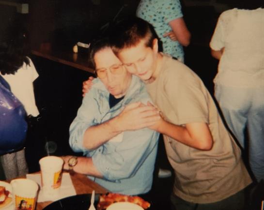 A man hugging another man