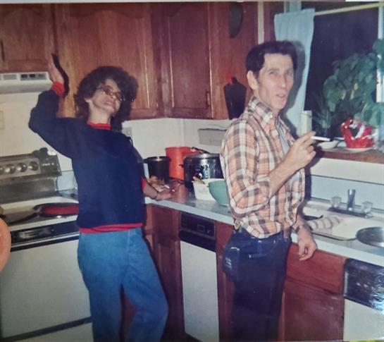 A man and woman in a kitchen