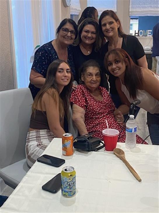 A cheerful group of women poses together, enjoying a moment of connection and joy.