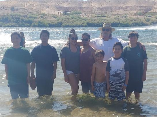 A group of people standing in water