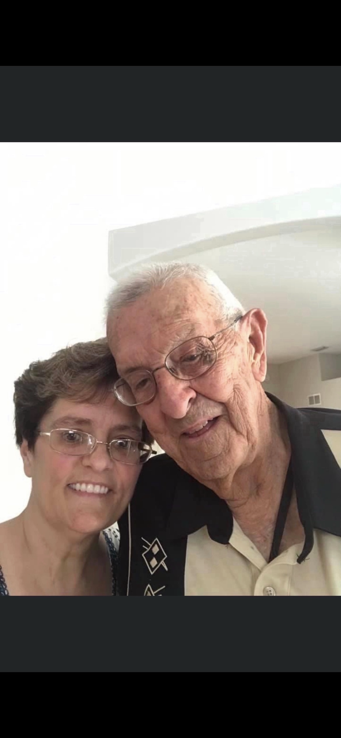 A man and woman taking a selfie