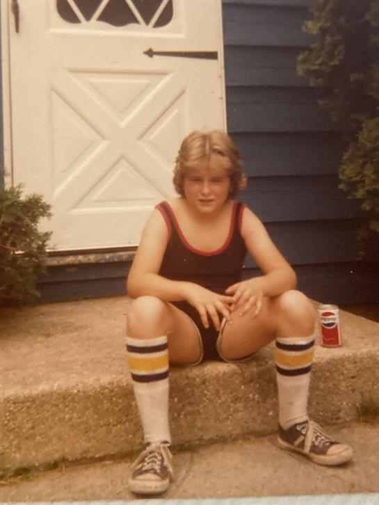 A boy sitting on a step