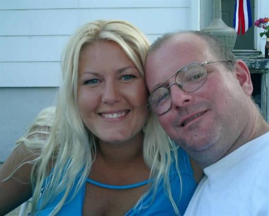 A man and woman smiling for a picture