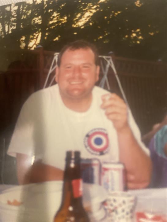 A man smiling at the camera