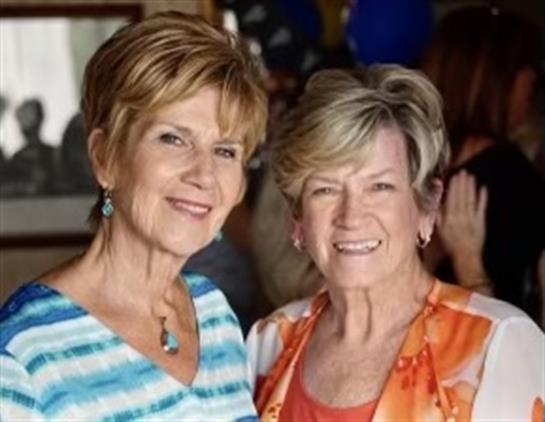 A couple of women smiling