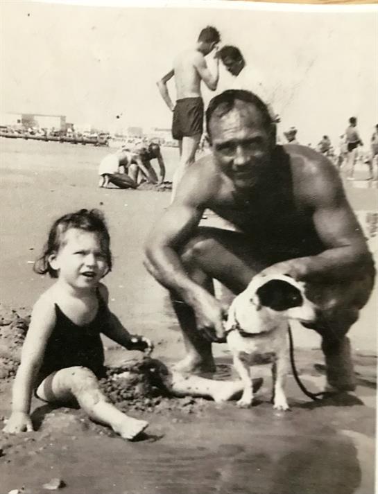 A man and a dog on a beach