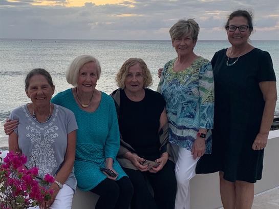 A group of women posing for a photo