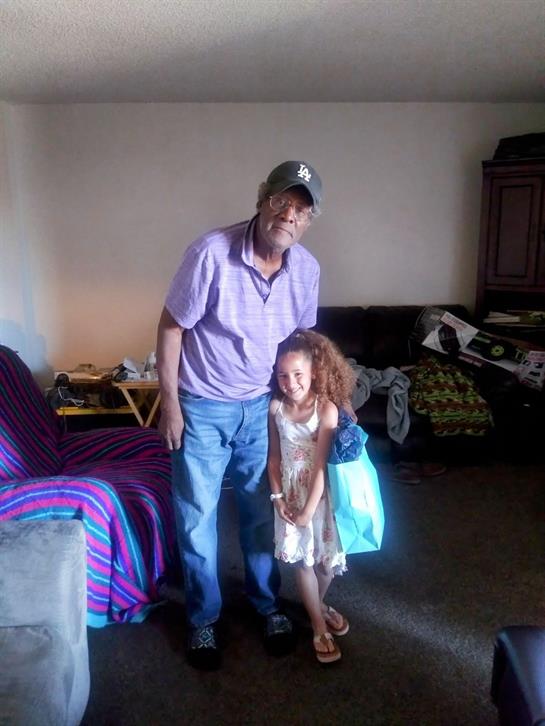 A man and a girl posing for a picture