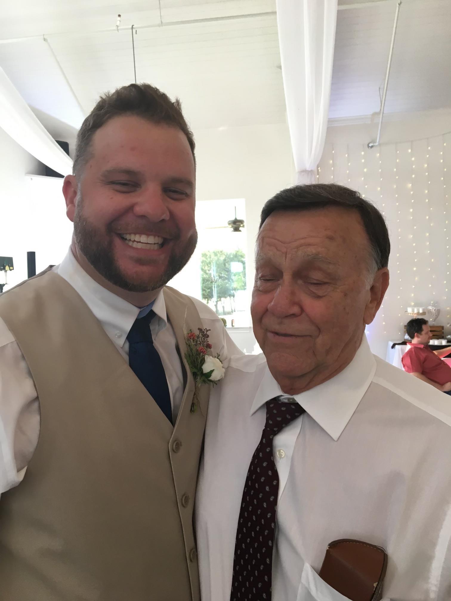 Family members enjoy a joyful moment together at a wedding reception, reflecting their bond.