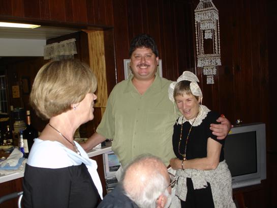 A group of people standing around each other