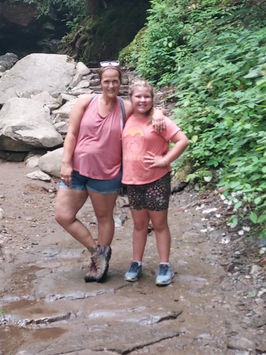 A woman and a girl posing for a picture