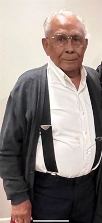 A man in a white shirt and black jacket