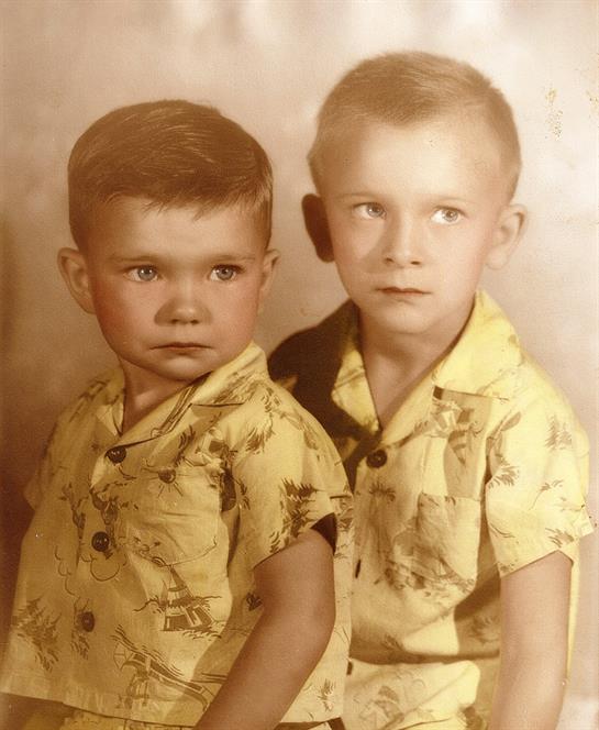 A couple of young boys in matching shirts