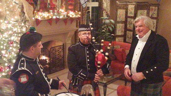 A group of men playing bagpipes