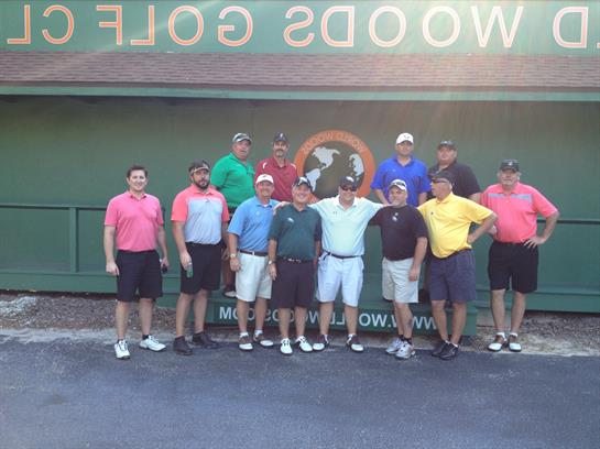 A group of men posing for a photo