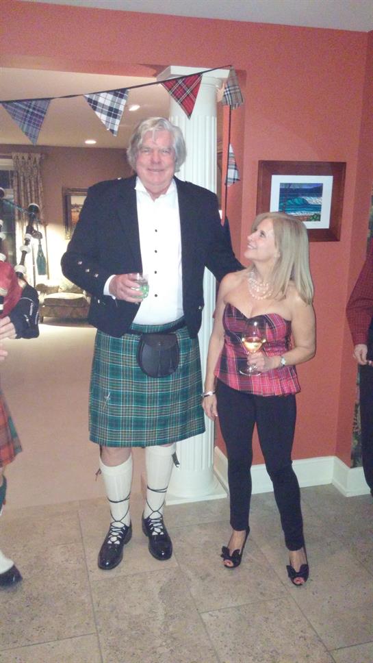 A man and woman in kilts